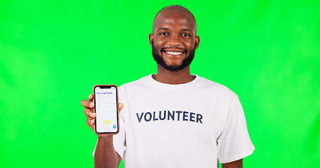 Image showing Black man, phone and social media, green screen and volunteer, community service with app and ads on studio background. Website sign up, register for charity work and male person help and nonprofit