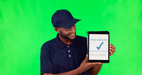 Image showing Tablet, delivery and complete with a black man on a green screen background in studio for distribution. Technology, supply chain logistics and order with a young male courier on chromakey mockup