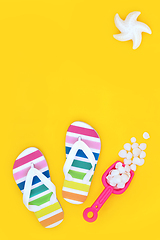 Image showing Summer Seaside Vacation with Rainbow Flip Flops