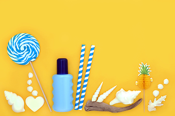 Image showing Summer Fun at the Beach with Sunscreen and Accessories 