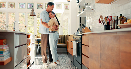 Image showing Love, dance and a happy couple in a kitchen at home with happiness, care and romance. Young woman and a man together in an apartment to hug, relax and bond for quality time, security and commitment