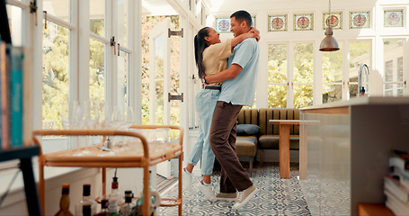 Image showing Happy, excited and a couple hug at home with love, care and romance. Young man lifting or spinning a woman together in an apartment to hug, relax or bond for quality time, security and commitment