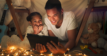 Image showing Tent, father and girl on tablet at night watching movies, online games and cartoon with fairy lights. Happy family, blanket and dad with child in bedroom on digital tech for bonding, relax and love