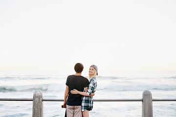 Image showing Couple, skateboard and happy on beach for travel with mockup space, adventure or promenade date. Gen z skater, people and portrait on boardwalk for bonding, embrace and outdoor fun with morning waves