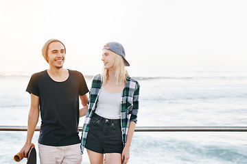 Image showing Couple, skateboard and smile by ocean for fun with mockup space, adventure and promenade date. Gen z skater, people and portrait on boardwalk for bonding, embrace and outdoor travel with beach waves