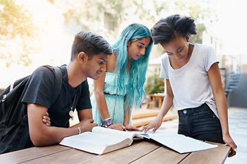 Image showing Students, group and reading outdoor at university with books, study and learning for education and campus. Friends, gen z people and teamwork research with smile, diversity and college break by table