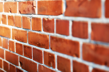 Image showing Building, red and closeup of brick wall in city for texture, background and pattern of exterior structure. Architecture, construction and surface of material, concrete and cement for decoration