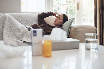 Image showing Tired woman, sick and headache with medication on sofa for flu, cold or sinus in living room at home. Young female person with illness, fever or influenza in fatigue or rest on couch from paracetamol