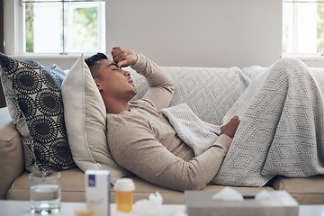 Image showing Sick man, headache and medication with flu, sinus or pain from illness on living room sofa at home. Tired male person with migraine from high fever, influenza or infection on lounge couch at house