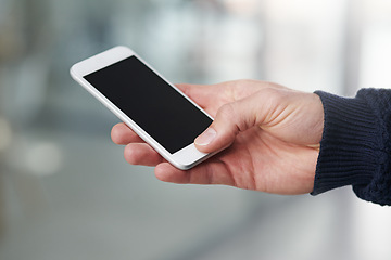 Image showing Person, hand and phone with mockup screen for advertising, marketing or app display at the office. Closeup of user touching or typing on mobile smartphone for online search, browsing or scrolling