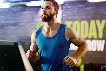 Image showing Gym, serious and man with running on treadmill for exercise, endurance workout and cardio health. Male person, athlete and training with machine for energy, body wellness and speed at fitness centre