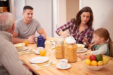 Image showing Home, family and eating breakfast together at table in the morning, hungry and bonding with grandfather. Father, mother and pour milk for kid with cereal, food or nutrition for healthy diet in house