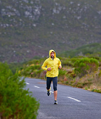 Image showing Running, winter and man with fitness, exercise and endurance with progress and morning cardio. Wet, runner and athlete with fitness and training with wind and nature with challenge, cold and wellness