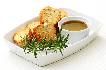 Image showing baguette and olive oil