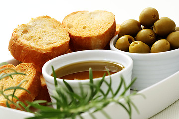 Image showing baguette and olive oil