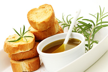 Image showing baguette and olive oil