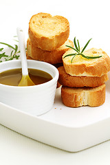 Image showing baguette and olive oil