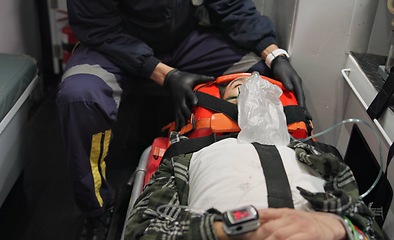 Image showing Patient, paramedic and man with oxygen mask in ambulance for emergency, injury or healthcare with neck brace. First responder, 911 and person with anesthesia for medical health, support or victim