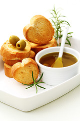 Image showing baguette and olive oil