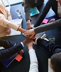 Image showing Diversity, business and group or team of hands in office for unity with support, trust and collaboration for work project. Above, people and huddle together with paperwork for partnership and goals.