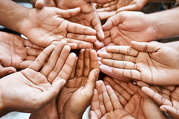 Image showing Hands, teamwork and collaboration in closeup with partnership and charity for community support. Group, people or friends and crowd palm for help, hope and goal or mission for solidarity and peace