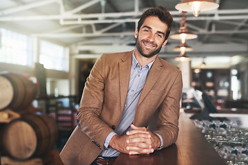 Image showing Portrait, man and small business of beer, bar and smile of entrepreneur, happiness and joy for pub. Startup, tavern and store for alcohol, person and owner in shop, confidence and pride for retail