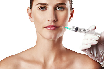 Image showing Woman, portrait and hands with needle for lips or cosmetic filler in studio on white background, anti aging or mockup. Female person, face and injection for dermatology, procedure or plastic surgery