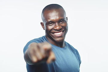 Image showing Black man, portrait and pointing to you with fitness for sign up, join or opportunity on a white studio background. Face of happy African or male person with smile for selection, choice or pick