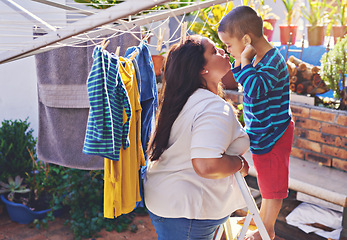 Image showing Mother, child and love for hanging washing with kiss or funny face with laundry housework, backyard or chore. Woman, son and ladder in garden or learning responsibility with help, teaching or hygiene