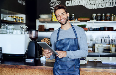 Image showing Waiter, cafe and portrait of man with tablet checking online review, web or tech in coffee shop. Networking, smile and welcome, restaurant manager or small business owner on digital app for service