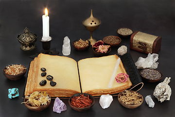 Image showing Witches Crystals Runes and Herbs with Book of Spells 