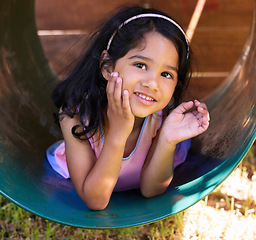 Image showing Girl, playground and wave with fun, youth and child outdoor in a park with greeting. Kid, smile and happy on school holiday and summer break in Mexico in a home garden with vacation in a yard