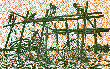 Image showing Men fishing with stick nets