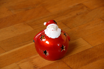 Image showing Christmas candlestick on parquet floor