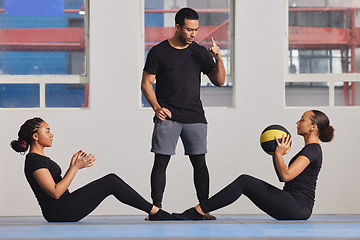 Image showing Gym, coach and fitness ball with training in class for exercise advice, support and challenge. Personal trainer, women and teamwork with equipment in workout for balance, calisthenics and development