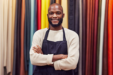 Image showing African man, portrait and smile for designer, small business owner and clothing workshop. Tailor, material and fashion product for boutique, retail and shopping startup for creative industry or store