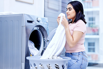 Image showing Laundry machine, smell and woman in home for cleaning, hygiene and housework in the morning. Chores, scent and girl with fresh fabric, cotton clothes and textile towel in washing basket for service