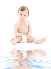 Image showing baby boy in diaper with toothbrush