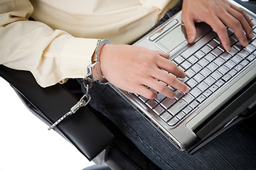 Image showing  Handcuffed working businessman