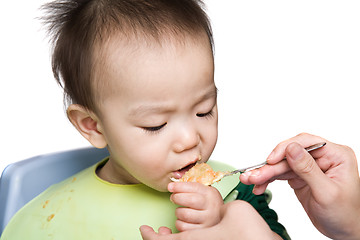 Image showing Baby feeding time