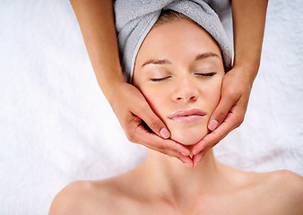 Image showing Woman, hands and facial massage or pamper treatment, cosmetics and beauty therapy. Female person, masseuse and serene or dermatology, skin care detox and above at spa for peace or zen and healing