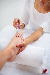 Image showing Foot, people and nail polish for pedicure closeup at spa, hands for treatment and skin with dermatology and makeup. Beauty, wellness and cosmetics product for color, self care and cosmetology