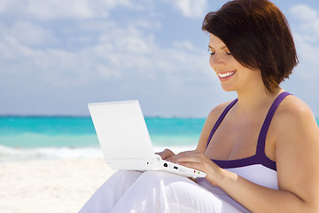 Image showing woman with laptop computer on the beach