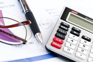 Image showing Tax calculator pen and glasses