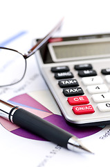 Image showing Tax calculator pen and glasses