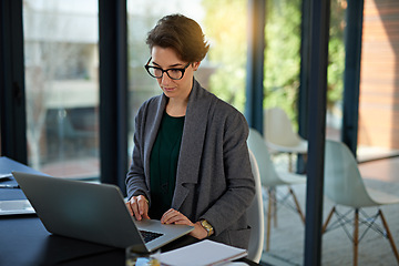 Image showing Lawyer, woman and laptop in office for legal planning, policy review or feedback on visa status. Attorney, immigration and female person in workplace for networking, online or asylum seekers aid