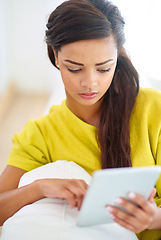 Image showing Woman, tablet and home on couch for streaming, fun or online with chat, social media and scrolling. Female person, house and relax for break, communication and internet with tech, typing or browsing