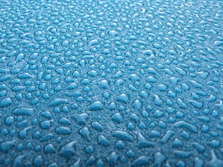 Image showing Water drops over blue plastic material