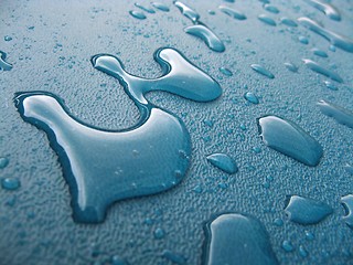 Image showing Water drops over blue plastic material