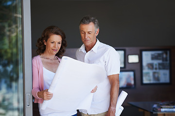 Image showing Mature couple, maintenance and interior design with blueprint or documents in renovation at house. Creative man or woman with paperwork, floor plan or layout in new start, home improvement or startup